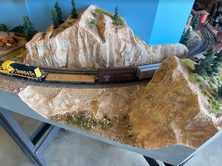 Image of model railroad with modeled landscaping