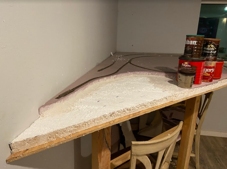 Image of model train landscaping foam board being prepared.